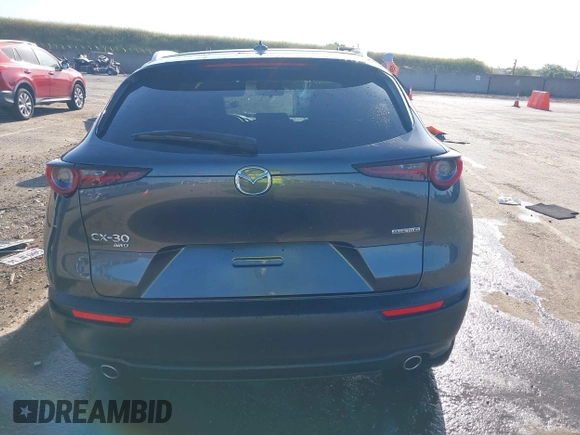 2022 Mazda CX-30 S Premium with VIN 3MVDMBDL0NM413867, listed as a IAAI auction lot 42082560 with 12,375 mi miles and . Bid and sale history available at DreamBid. Image 16.