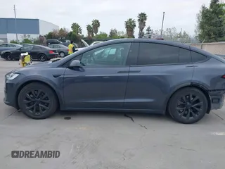 2022 Tesla Model X Plaid with VIN 7SAXCBE6XNF337687, listed as a IAAI auction lot 42035097 with 18,756 mi miles and . Bid and sale history available at DreamBid. Image 15.