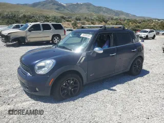 2013 MINI Countryman S ALL4 with VIN WMWZC5C50DWM15256, listed as a Copart auction lot 58080895 with 123,514 mi miles and Salvage title. Bid and sale history available at DreamBid. Image 1.
