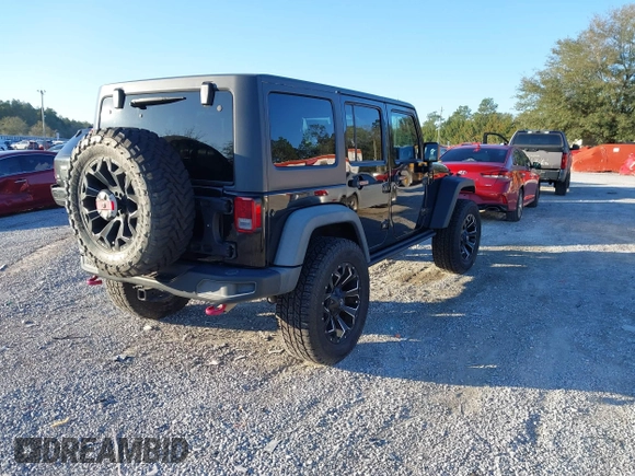 2015 Jeep Wrangler Unlimited Rubicon with VIN 1C4BJWFGXFL610153, listed as a IAAI auction lot 41575401 with 114,583 mi miles. Bid and sale history available at carsss.com. Image 4.