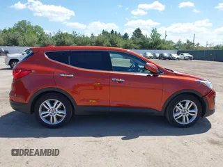 2013 Hyundai Santa Fe Sport z VIN 5XYZWDLA9DG094235, wystawiony jako IAAI lot #42264045 z przebiegiem 103 742 mil mil oraz . Historia ofert i sprzedaży dostępna na DreamBid. Obrazek 13.