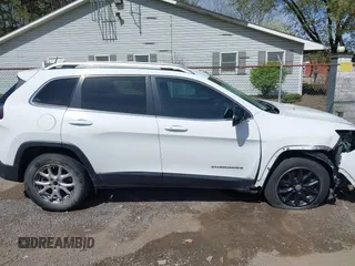 2015 Jeep Cherokee Latitude with VIN 1C4PJLCS3FW670254, listed as a IAAI auction lot 42060659 with 164,291 mi miles. Bid and sale history available at carsss.com. Image 14.