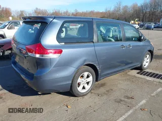 2014 Toyota Sienna L with VIN 5TDZK3DC0ES413970, listed as a IAAI auction lot 40870422 with 138,589 mi miles. Bid and sale history available at carsss.com. Image 4.