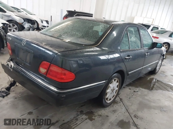 1997 Mercedes-Benz E-Class with VIN WDBJF55F8VA415421, listed as a IAAI auction lot 41536015 with 237,345 mi miles. Bid and sale history available at carsss.com. Image 4.