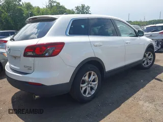 2014 Mazda CX-9 Touring z VIN JM3TB3CV7E0426900, wystawiony jako IAAI lot #42796725 z przebiegiem Nie podano mil oraz . Historia ofert i sprzedaży dostępna na DreamBid. Obrazek 4.