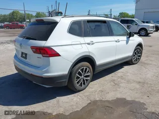 2021 Volkswagen Tiguan SE with VIN 3VV2B7AX4MM031490, listed as a IAAI auction lot 41829654 with 55,739 mi miles. Bid and sale history available at carsss.com. Image 4.
