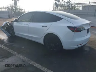 2021 Tesla Model 3 Long Range with VIN 5YJ3E1EB0MF009965, listed as a IAAI auction lot 41478233 with 31,713 mi miles and . Bid and sale history available at DreamBid. Image 3.
