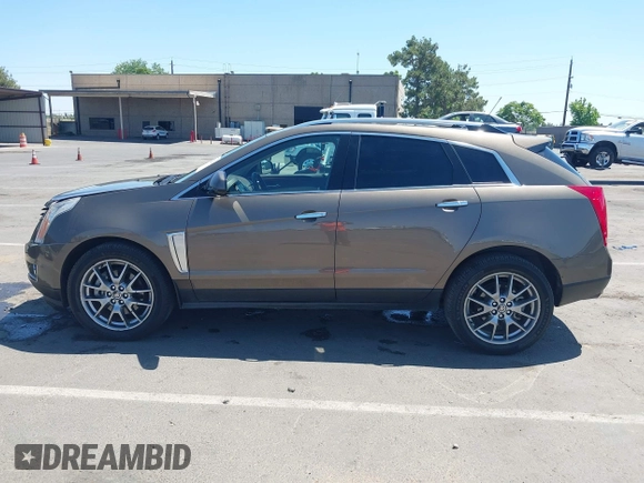 2015 Cadillac SRX Performance Collection with VIN 3GYFNFE35FS569682, listed as a IAAI auction lot 42322229 with 124,365 mi miles and . Bid and sale history available at DreamBid. Image 14.