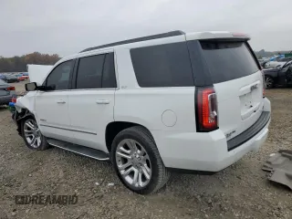 2019 GMC Yukon SLT with VIN 1GKS2BKC2KR338007, listed as a Copart auction lot 82336394 with 105,087 mi miles and Salvage Title. Bid and sale history available at carsss.com. Image 2.