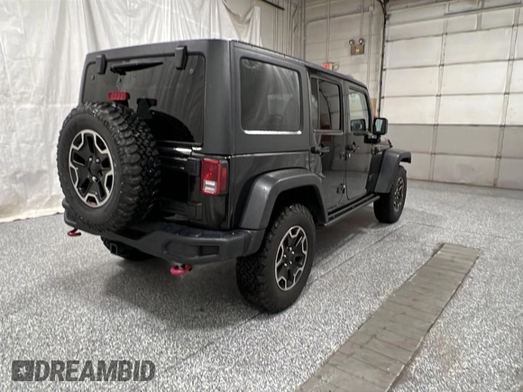 2014 Jeep Wrangler Unlimited Rubicon X with VIN 1C4HJWFG2EL312737, listed as a Copart auction lot 56547735 with 121,477 mi miles and Clean title. Bid and sale history available at DreamBid. Image 4.