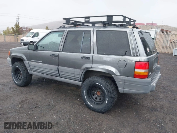 1997 Jeep Grand Cherokee Laredo with VIN 1J4GZ58Y8VC624804, listed as a IAAI auction lot 41736324 with 165,851 mi miles. Bid and sale history available at carsss.com. Image 3.