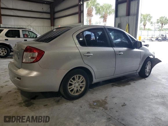 2012 Suzuki SX4 LE z VIN JS2YC5A34C6304150, wystawiony jako Copart lot #48629255 z przebiegiem 104 658 mil mil oraz Szkoda całkowita • Salvage title. Historia ofert i sprzedaży dostępna na DreamBid. Obrazek 3.