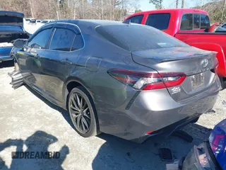 2023 Toyota Camry SE with VIN 4T1G11AK5PU116584, listed as a IAAI auction lot 41298269 with 28,994 mi miles. Bid and sale history available at carsss.com. Image 3.