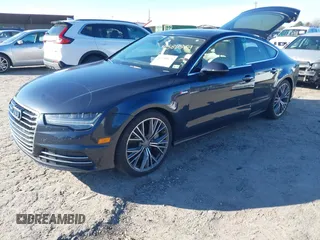 2016 Audi A7 3.0 Premium Plus with VIN WAUWGAFC4GN144738, listed as a IAAI auction lot 41580879 with 146,375 mi miles. Bid and sale history available at carsss.com. Image 2.