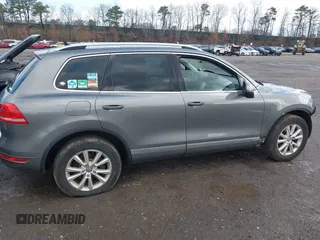 2013 Volkswagen Touareg Lux with VIN WVGEF9BPXDD000679, listed as a IAAI auction lot 41956471 with 117,465 mi miles and . Bid and sale history available at DreamBid. Image 13.