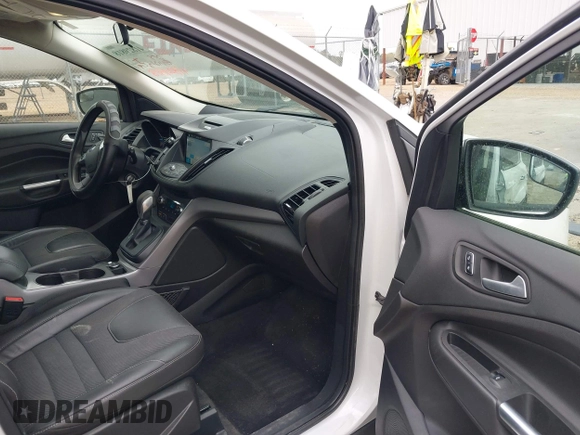 2016 Ford Escape SE with VIN 1FMCU0GX0GUA95789, listed as a IAAI auction lot 41829818 with 84,431 mi miles. Bid and sale history available at carsss.com. Image 5.