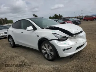 2023 Tesla Model Y Long Range z VIN 7SAYGAEE0PF693613, wystawiony jako Copart lot #54452895 z przebiegiem 19 574 mil mil oraz Szkoda całkowita • Salvage title. Historia ofert i sprzedaży dostępna na DreamBid. Obrazek 4.