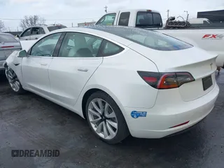 2020 Tesla Model 3 Standard Range Plus with VIN 5YJ3E1EA0LF741311, listed as a IAAI auction lot 41581931 with 43,284 mi miles. Bid and sale history available at carsss.com. Image 3.