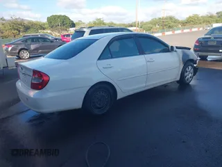 2002 Toyota Camry LE z VIN JTDBE32K120093737, wystawiony jako IAAI lot #41214245 z przebiegiem Nie podano mil oraz . Historia ofert i sprzedaży dostępna na DreamBid. Obrazek 4.