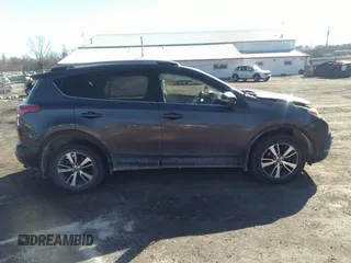 2018 Toyota RAV4 XLE with VIN JTMRFREV9JJ742276, listed as a IAAI auction lot 41855530 with 115,815 mi miles. Bid and sale history available at carsss.com. Image 13.