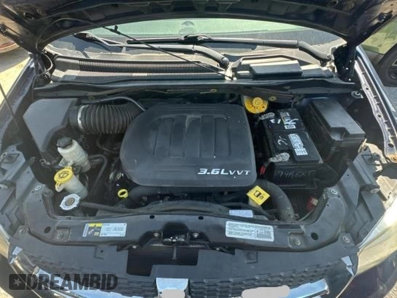 2014 Dodge Grand Caravan SXT with VIN 2C4RDGCG1ER308403, listed as a Copart auction lot 47603045 with 131,847 mi miles and Clean Title. Bid and sale history available at DreamBid. Image 7.