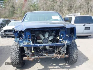 2014 Toyota Tacoma with VIN 3TMLU4EN0EM153558, listed as a IAAI auction lot 41964890 with 140,864 mi miles and . Bid and sale history available at DreamBid. Image 13.