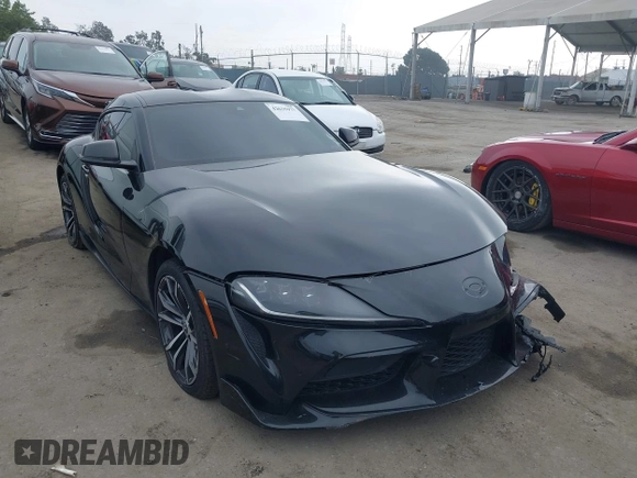 2021 Toyota Supra 2.0 with VIN WZ1DB2C07MW042723, listed as a IAAI auction lot 42635977 with 54,011 mi miles and . Bid and sale history available at DreamBid. Image 1.