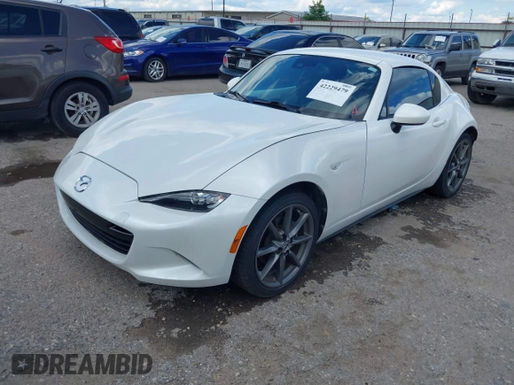 2020 Mazda MX-5 Miata Grand Touring z VIN JM1NDAM79L0411456, wystawiony jako IAAI lot #42229479 z przebiegiem 63 508 mil mil oraz . Historia ofert i sprzedaży dostępna na DreamBid. Obrazek 17.