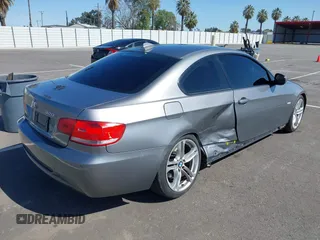 2010 BMW 3 Series 328i with VIN WBAWV1C51AP123689, listed as a IAAI auction lot 41966621 with 187,428 mi miles. Bid and sale history available at carsss.com. Image 4.