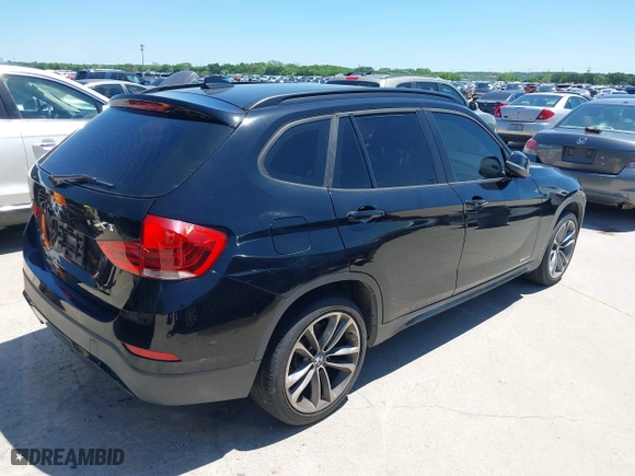 2014 BMW X1 sDrive28i with VIN WBAVM1C5XEVW51666, listed as a IAAI auction lot 42083936 with 176,465 mi miles. Bid and sale history available at carsss.com. Image 4.