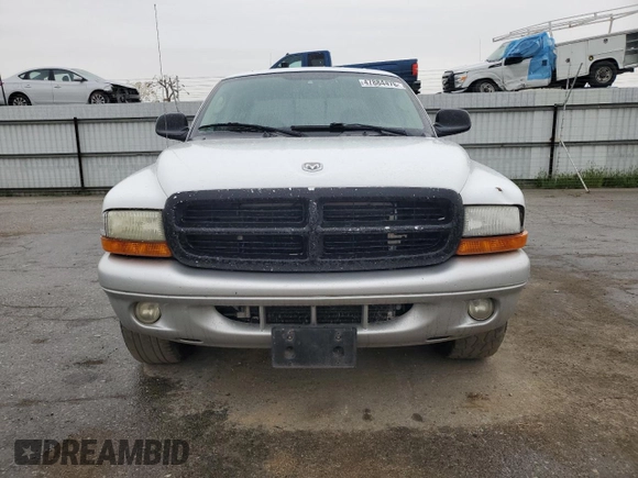 2002 Dodge Dakota SLT z VIN 1B7HL48N22S636413, wystawiony jako Copart lot #47884475 z przebiegiem 226 723 mil mil oraz Czysty tytuł • Clean title. Historia ofert i sprzedaży dostępna na DreamBid. Obrazek 5.