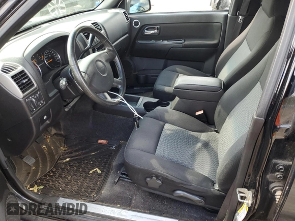 2011 GMC Canyon SLE1 with VIN 1GTH6MFE8B8102114, listed as a Copart auction lot 74137234 with 150,598 mi miles and Salvage title. Bid and sale history available at DreamBid. Image 7.