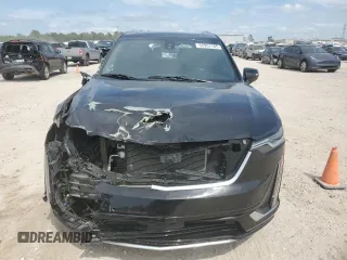 2023 Cadillac XT6 FWD Premium Luxury with VIN 1GYKPCRS6PZ127331, listed as a Copart auction lot 52951105 with 47,796 mi miles and Salvage Title. Bid and sale history available at carsss.com. Image 5.