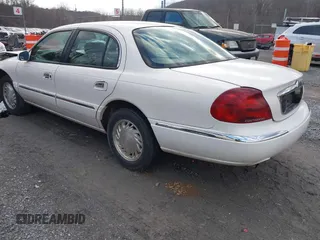 1998 Lincoln Continental with VIN 1LNFM97VXWY619313, listed as a IAAI auction lot 41477852 with 158,973 mi miles. Bid and sale history available at carsss.com. Image 3.