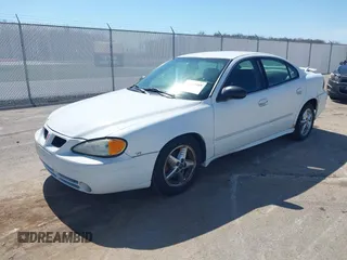 2004 Pontiac Grand Am SE1 with VIN 1G2NF52EX4M594173, listed as a IAAI auction lot 41812409 with 130,793 mi miles. Bid and sale history available at carsss.com. Image 2.