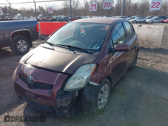 2009 Toyota Yaris with VIN JTDKT903X95258654, listed as a IAAI auction lot 41759756 with 93,810 mi miles. Bid and sale history available at carsss.com. Image 2.
