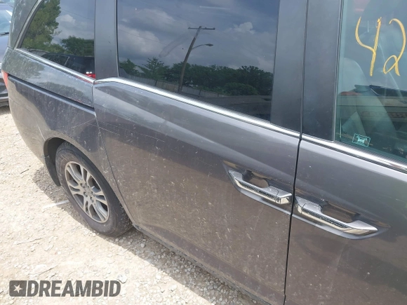 2012 Honda Odyssey EX-L with VIN 5FNRL5H60CB054277, listed as a IAAI auction lot 42459861 with 205,722 mi miles and . Bid and sale history available at DreamBid. Image 6.