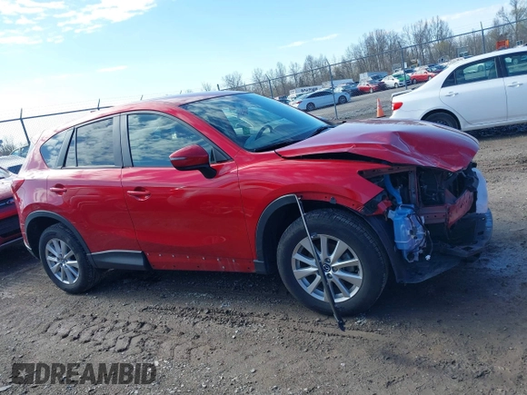 2016 Mazda CX-5 Touring with VIN JM3KE4CY5G0630438, listed as a IAAI auction lot 41877660 with 56,960 mi miles. Bid and sale history available at carsss.com. Image 14.