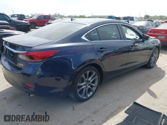 2016 Mazda 6 i Grand Touring with VIN JM1GJ1W59G1439075, listed as a IAAI auction lot 41792755 with 99,215 mi miles and . Bid and sale history available at DreamBid. Image 4.