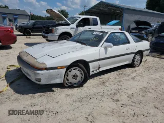 1986 Toyota Supra z VIN JT2MA70L7G0014661, wystawiony jako Copart lot #72161554 z przebiegiem 160 516 mil mil oraz Czysty tytuł • Clean title. Historia ofert i sprzedaży dostępna na DreamBid. Obrazek 1.