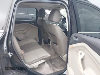 2013 Ford Escape SE with VIN 1FMCU0GX5DUB68604, listed as a IAAI auction lot 42126594 with 165,540 mi miles and . Bid and sale history available at carsss.com. Image 8.