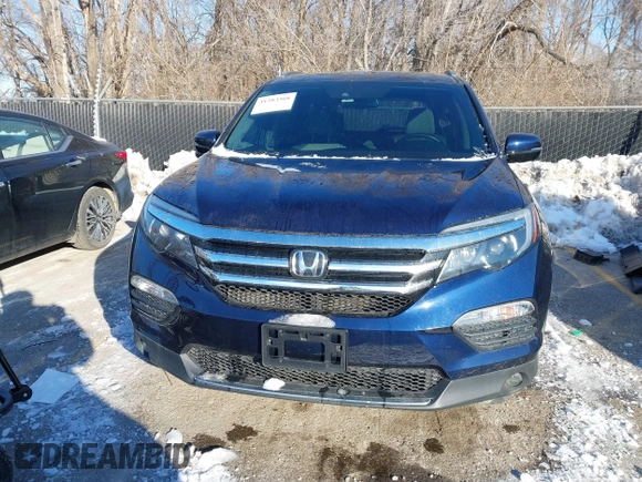 2017 Honda Pilot Touring with VIN 5FNYF6H99HB105446, listed as a IAAI auction lot 41283368 with 91,452 mi miles and . Bid and sale history available at DreamBid. Image 13.