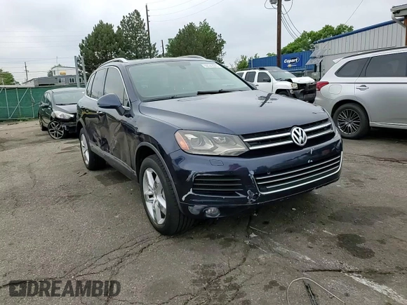 2011 Volkswagen Touareg Lux z VIN WVGFK9BP4BD001551, wystawiony jako Copart lot #58743065 z przebiegiem 142 661 mil mil oraz Szkoda całkowita • Salvage title. Historia ofert i sprzedaży dostępna na DreamBid. Obrazek 14.