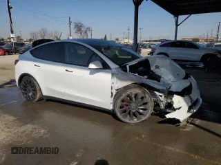 2022 Tesla Model Y Performance with VIN 7SAYGDEF8NF381644, listed as a Copart auction lot 44554585 with 71,413 mi miles and Salvage Title. Bid and sale history available at DreamBid. Image 4.