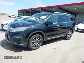 2019 Honda Pilot Touring 7-Passenger with VIN 5FNYF6H67KB031988, listed as a IAAI auction lot 42519588 with 41,368 mi miles and . Bid and sale history available at DreamBid. Image 22.