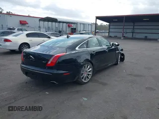 2015 Jaguar XJ with VIN SAJWA1CZ9F8V78228, listed as a IAAI auction lot 41260138 with 52,622 mi miles. Bid and sale history available at carsss.com. Image 4.
