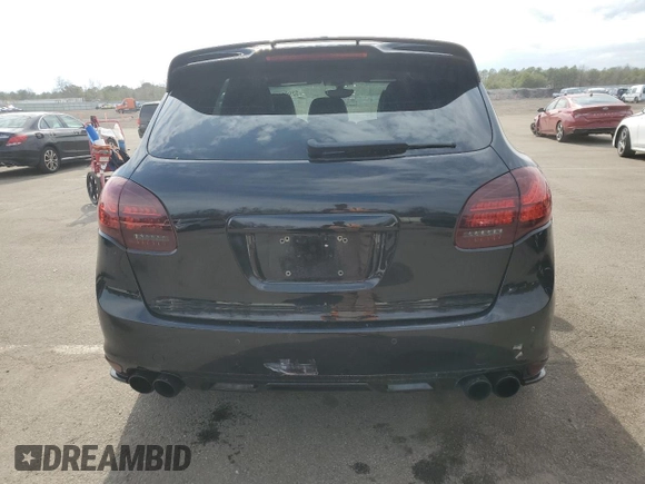 2013 Porsche Cayenne GTS с VIN WP1AD2A29DLA72323, выставлен на аукционе Copart как лот 52990885 с пробегом 100 812 миль миль и Списание • Salvage title. История ставок и продаж доступна на DreamBid. Изображение 6.