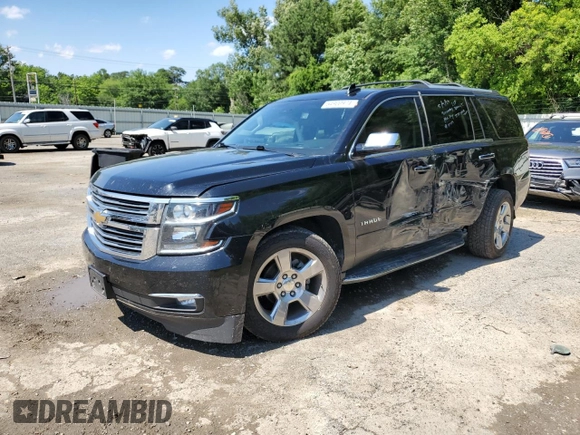 2018 Chevrolet Tahoe Premier with VIN 1GNSKCKC1JR133625, listed as a Copart auction lot 54900974 with 130,921 mi miles and Salvage title. Bid and sale history available at DreamBid. Image 1.