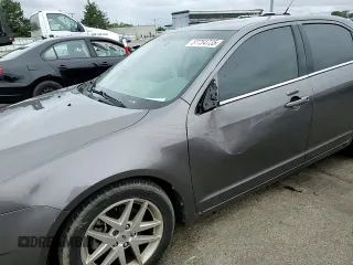 2012 Ford Fusion SEL z VIN 3FAHP0JA2CR232860, wystawiony jako Copart lot #57754735 z przebiegiem 234 638 mil mil oraz Szkody całkowita. Historia ofert i sprzedaży dostępna na DreamBid. Obrazek 13.