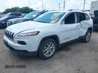 2018 Jeep Cherokee Latitude Plus with VIN 1C4PJLLBXJD590695, listed as a IAAI auction lot 39653845 with 76,667 mi miles and . Bid and sale history available at DreamBid. Image 17.